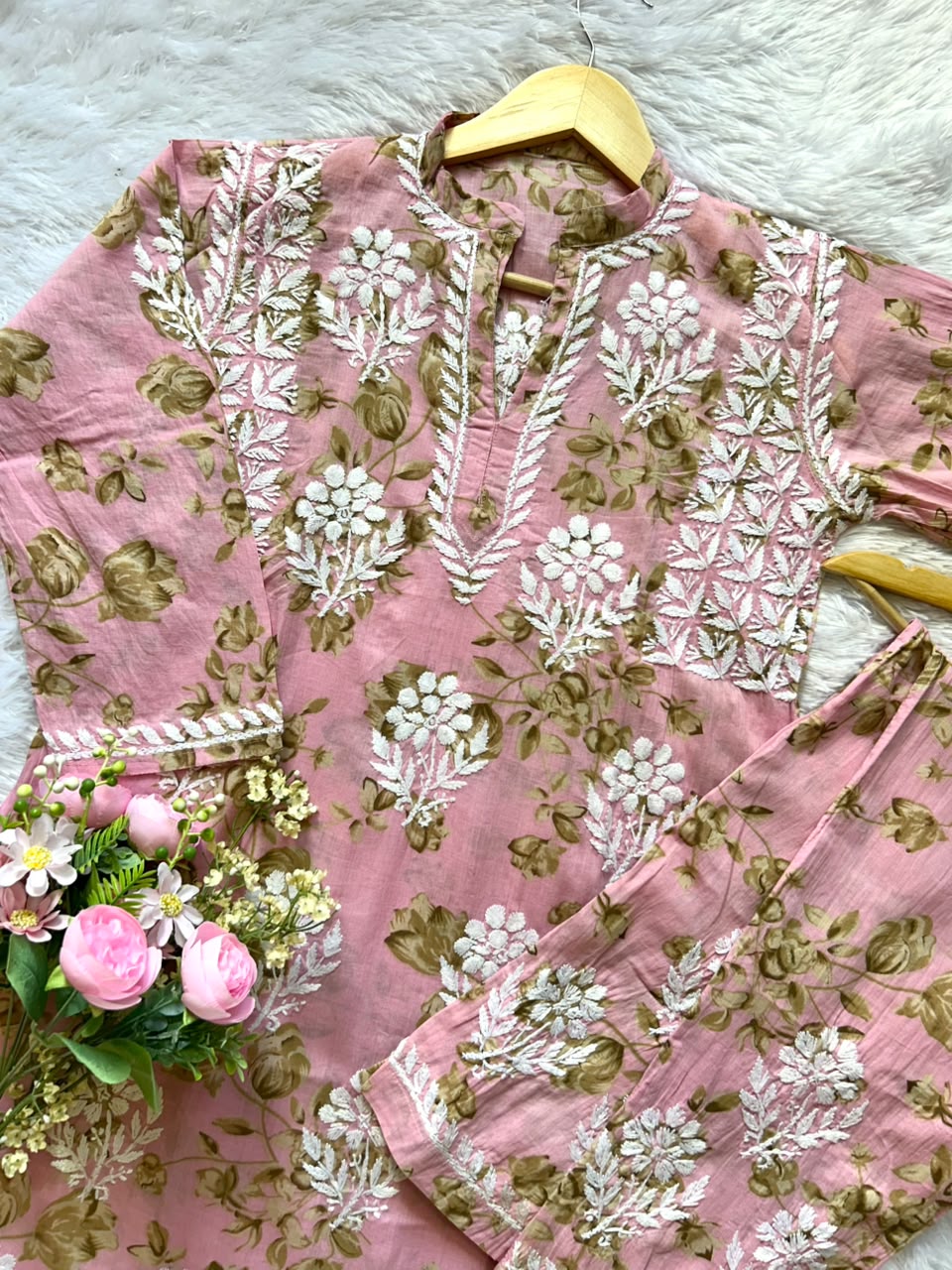 
Sana pink mul mul Lucknowi chikankari kurta set featuring delicate hand embroidery and soft breathable fabric for graceful everyday and festive ethnic wear by Hayat's Lucknowi.
