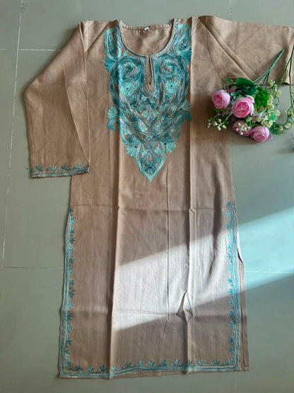 
Sehra sand brown cotton Kashmiri mid-length embroidered kurta featuring intricate traditional Kashmiri embroidery and soft breathable cotton fabric for elegant everyday ethnic wear by Hayat's Lucknowi.
