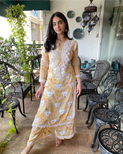 Yellow mul mul kurta set with printed chikankari embroidery by Hayat’s Lucknowi