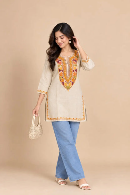 Sona Light Beige Cotton Kashmiri Short Embroidered Kurti featuring intricate traditional Kashmiri embroidery on soft, breathable cotton fabric for an elegant everyday ethnic look by Hayat’s Lucknowi.
