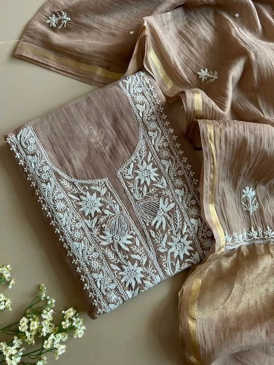 
Sonal women's taupe brown mul Chanderi handwork kurta and dupatta unstitched suit featuring intricate handcrafted detailing and elegant traditional craftsmanship for sophisticated ethnic wear by Hayat's Lucknowi.
