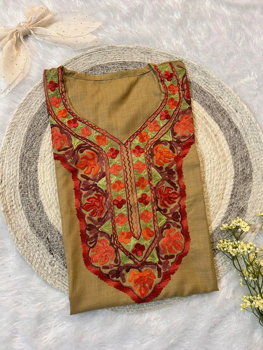 
Khaki Kashmiri short kurta designed with classic handcrafted detailing by Hayat's Lucknowi
