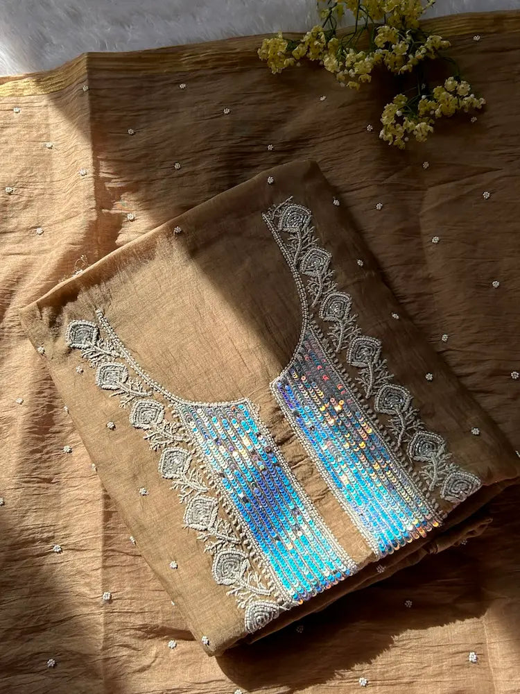 
Tabish women's brown mul Chanderi handwork kurta and dupatta unstitched suit featuring intricate handcrafted detailing and elegant traditional craftsmanship for timeless ethnic wear by Hayat's Lucknowi.
