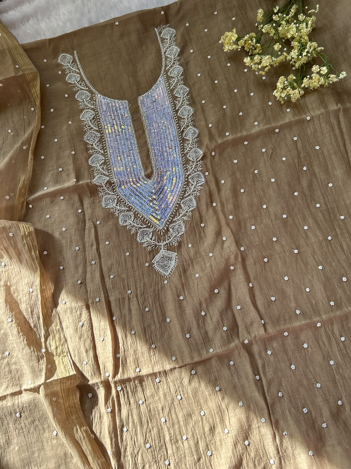 
Tabish women's brown mul Chanderi handwork kurta and dupatta unstitched suit featuring intricate handcrafted detailing and elegant traditional craftsmanship for timeless ethnic wear by Hayat's Lucknowi.
