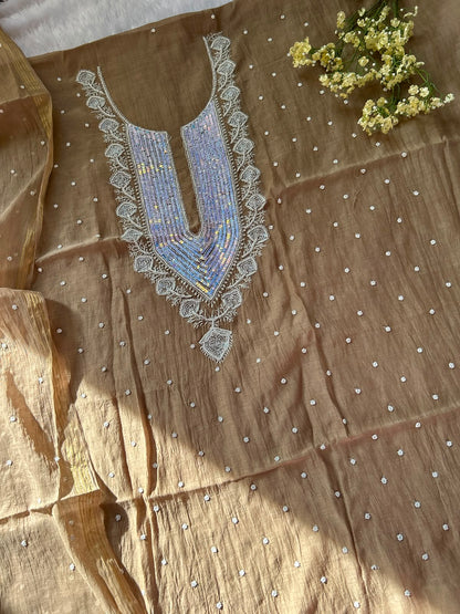 
Tabish women's brown mul Chanderi handwork kurta and dupatta unstitched suit featuring intricate handcrafted detailing and elegant traditional craftsmanship for timeless ethnic wear by Hayat's Lucknowi.
