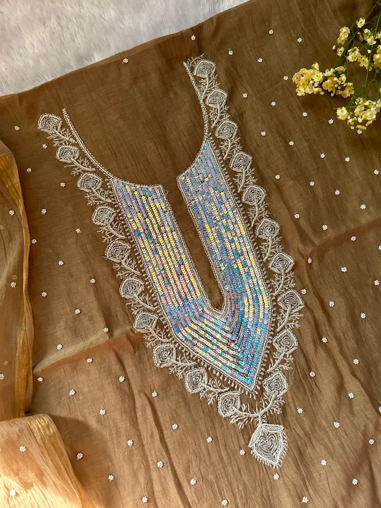 
Tabish women's brown mul Chanderi handwork kurta and dupatta unstitched suit featuring intricate handcrafted detailing and elegant traditional craftsmanship for timeless ethnic wear by Hayat's Lucknowi.
