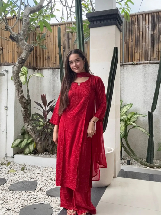 Woman in a red outfit chikankari dress kurta plazo and dupatta indian style