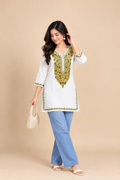 White Cotton Kashmiri Short Embroidered Kurti featuring intricate traditional Kashmiri embroidery on soft, breathable cotton fabric for an elegant everyday ethnic look by Hayat’s Lucknowi.
