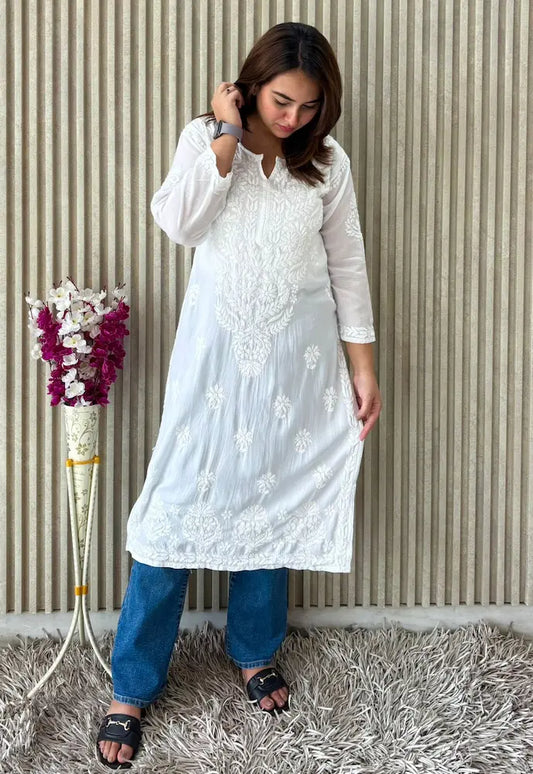 
White modal Lucknowi chikankari kurta adorned with intricate hand embroidery for a classic and elegant ethnic look by Hayat's Lucknowi
