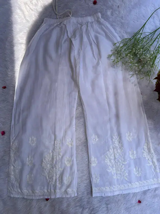 White suit set with chikankari embroidery by Hayat’s Lucknowi