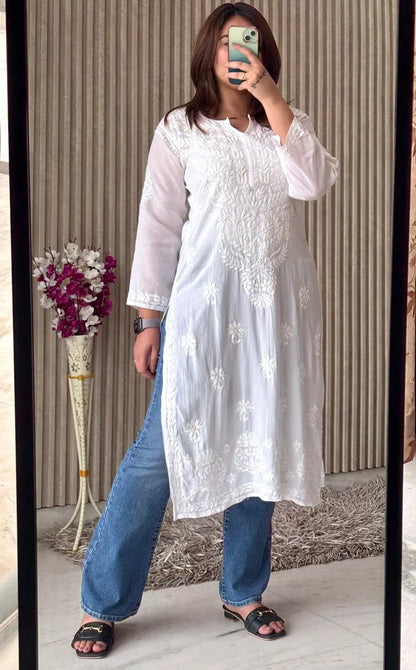 
White modal Lucknowi chikankari kurta adorned with intricate hand embroidery for a classic and elegant ethnic look by Hayat's Lucknowi
