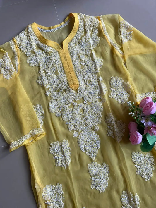 Ayena Yellow Georgette Chikankari Kurti featuring intricate hand embroidery on lightweight georgette fabric for an elegant festive and ethnic look by Hayat’s Lucknowi.
