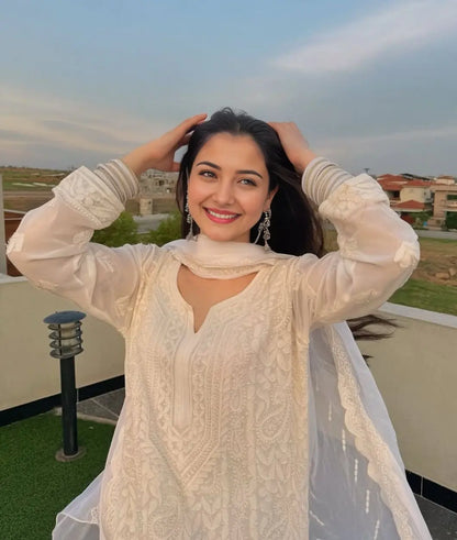 
Yusra white georgette chikankari kurti featuring delicate Lucknowi embroidery for graceful and stylish ethnic wear by Hayat's Lucknowi