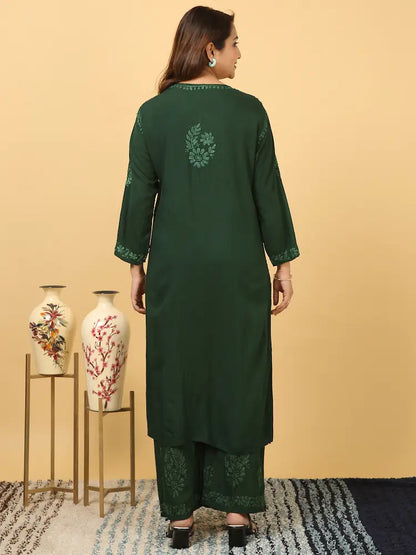 
Zeenat bottle green rayon Lucknowi chikankari kurta set with dupatta featuring intricate hand embroidery for a graceful and elegant ethnic ensemble by Hayat's Lucknowi
