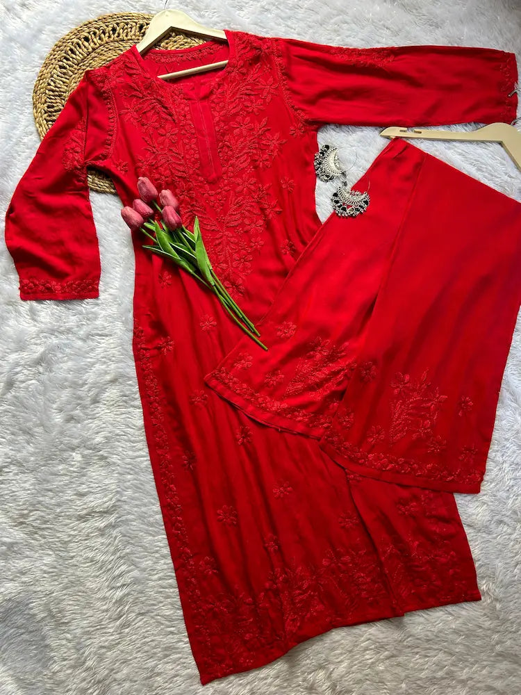 
Zeenat red rayon Lucknowi chikankari kurta set with dupatta featuring intricate hand embroidery and elegant traditional craftsmanship for graceful festive and ethnic wear by Hayat's Lucknowi.
