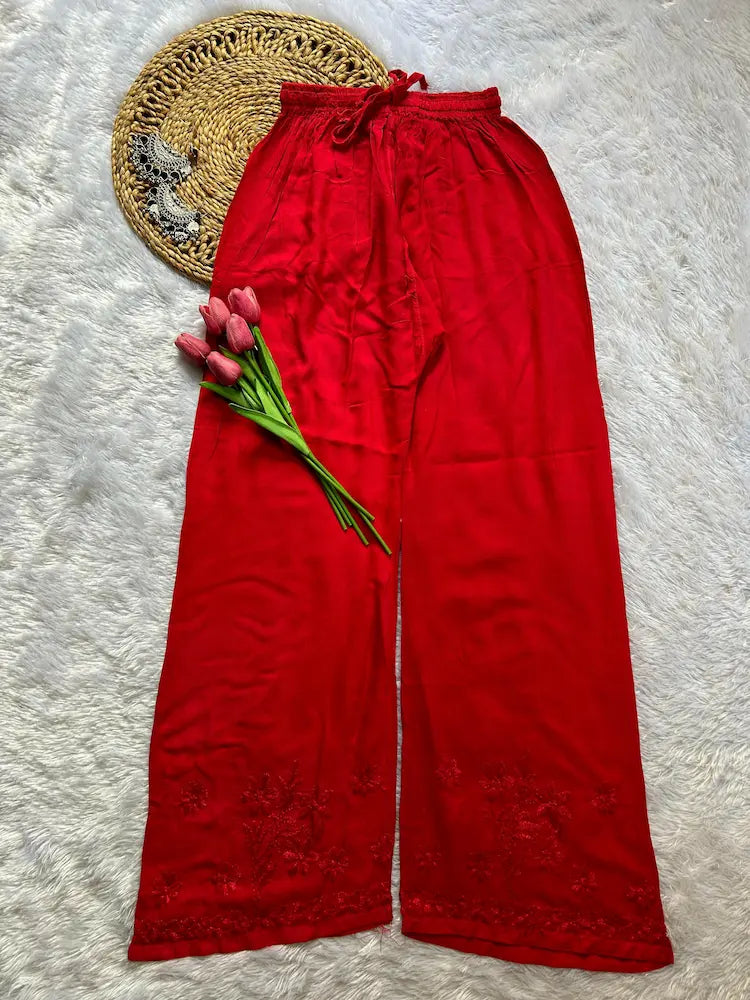
Zeenat red rayon Lucknowi chikankari kurta set with dupatta featuring intricate hand embroidery and elegant traditional craftsmanship for graceful festive and ethnic wear by Hayat's Lucknowi.
