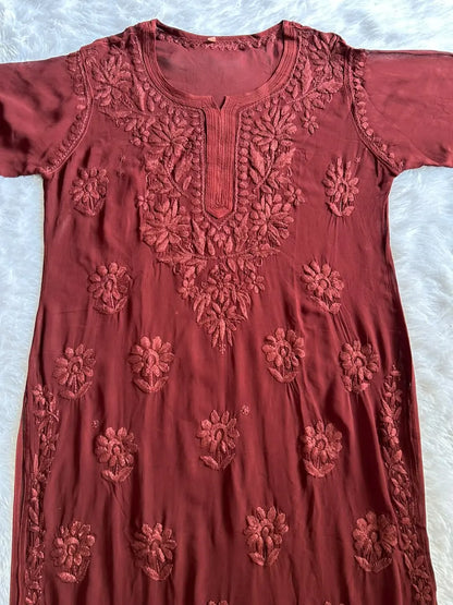 Zoya Brown Georgette Chikankari Kurta Set with Dupatta featuring intricate hand embroidery on lightweight georgette fabric for an elegant festive and ethnic look by Hayat’s Lucknowi.
