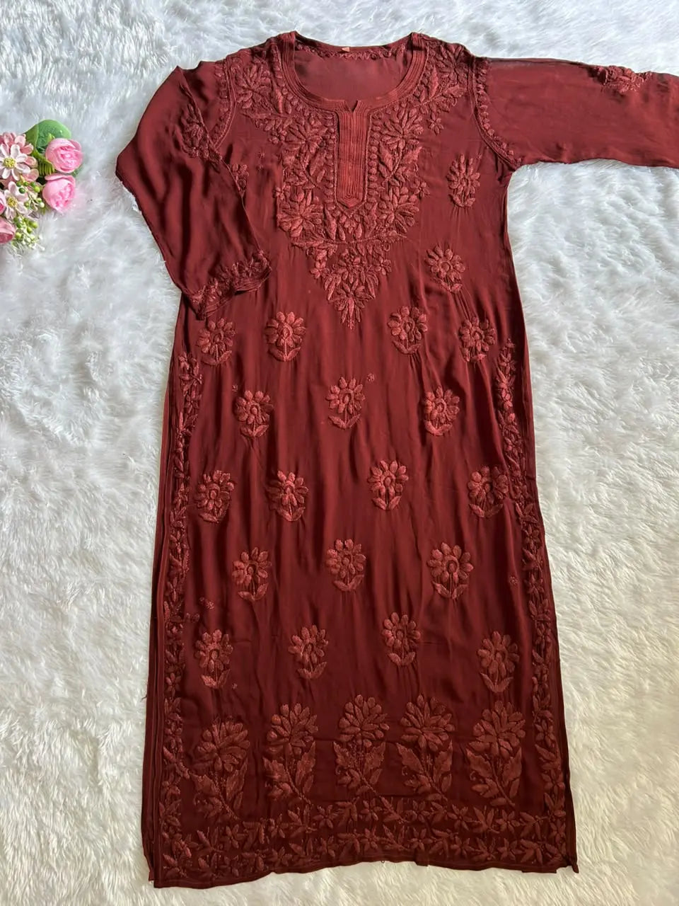 Zoya Brown Georgette Chikankari Kurta Set with Dupatta featuring intricate hand embroidery on lightweight georgette fabric for an elegant festive and ethnic look by Hayat’s Lucknowi.
