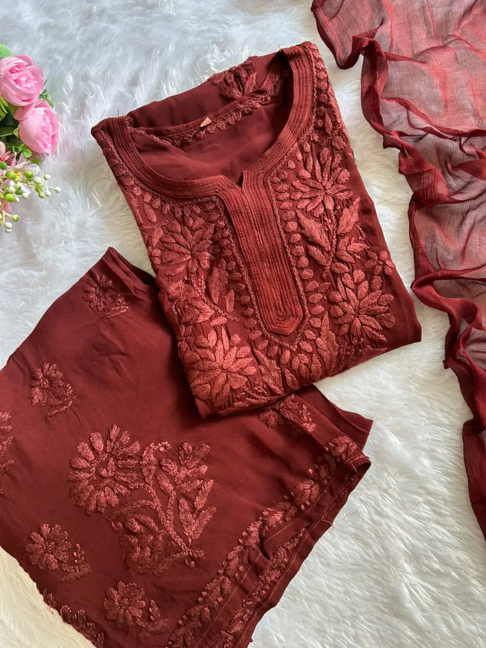 Zoya Brown Georgette Chikankari Kurta Set with Dupatta featuring intricate hand embroidery on lightweight georgette fabric for an elegant festive and ethnic look by Hayat’s Lucknowi.
