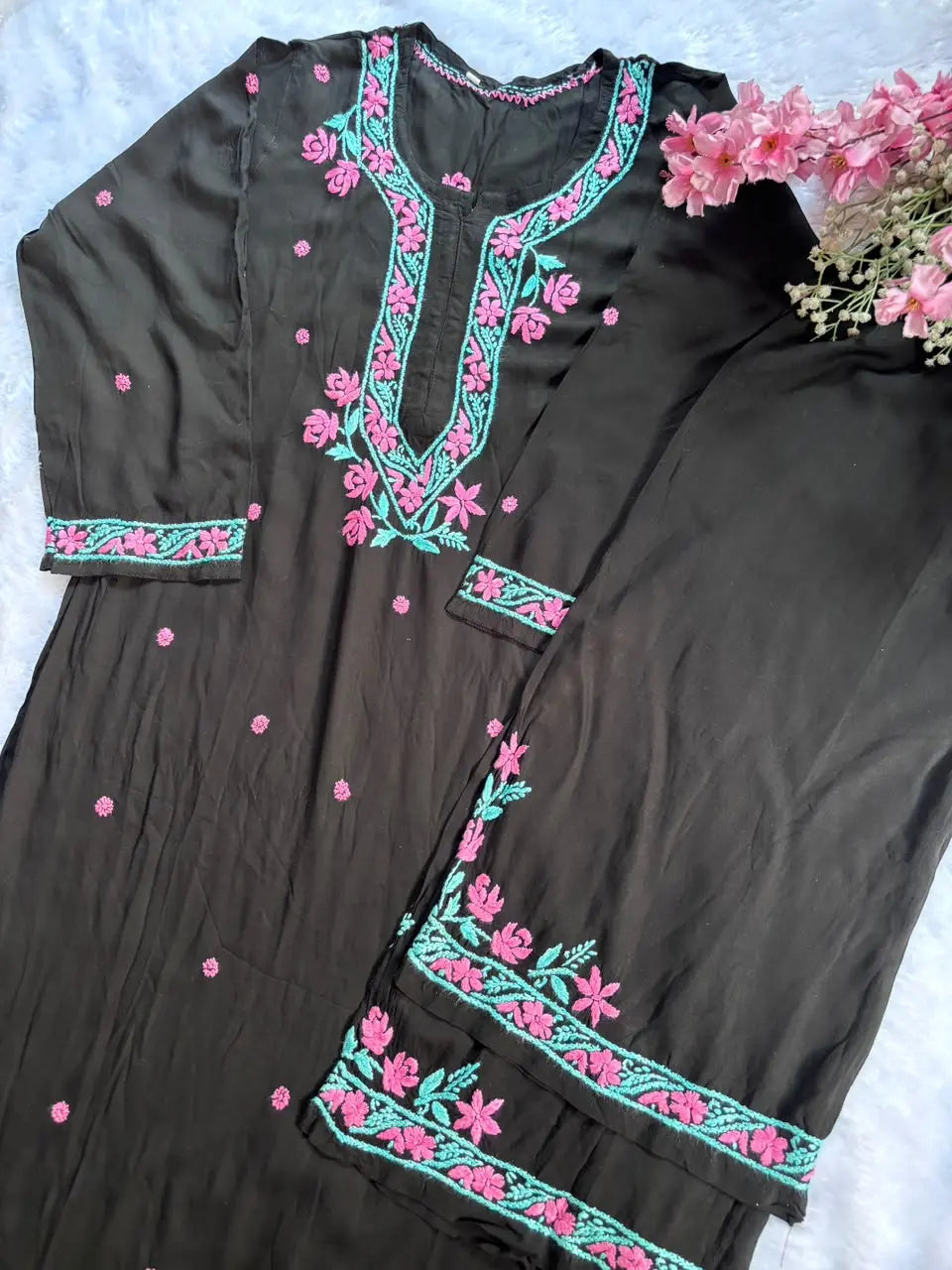 a black kurta set with floral hand embroidered best for work wear and everyday