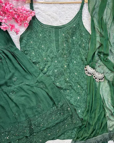 Bottle green georgette gharara set with chikankari and mukesh embroidery by Hayat’s Lucknowi
