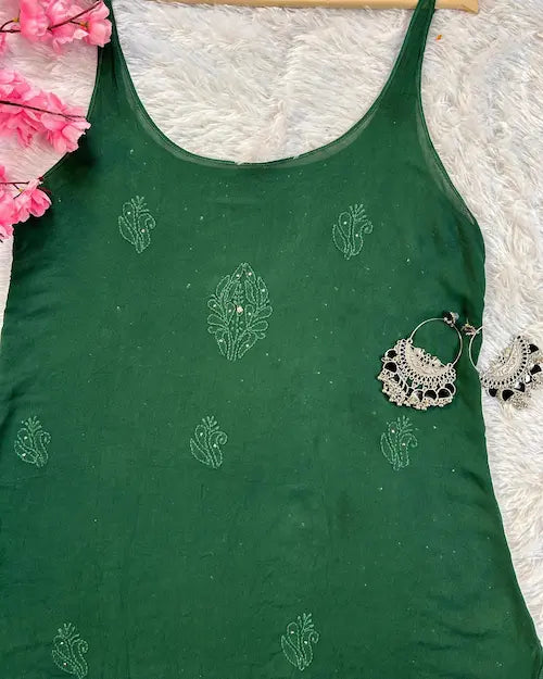 Bottle green georgette gharara set with chikankari and mukesh embroidery by Hayat’s Lucknowi