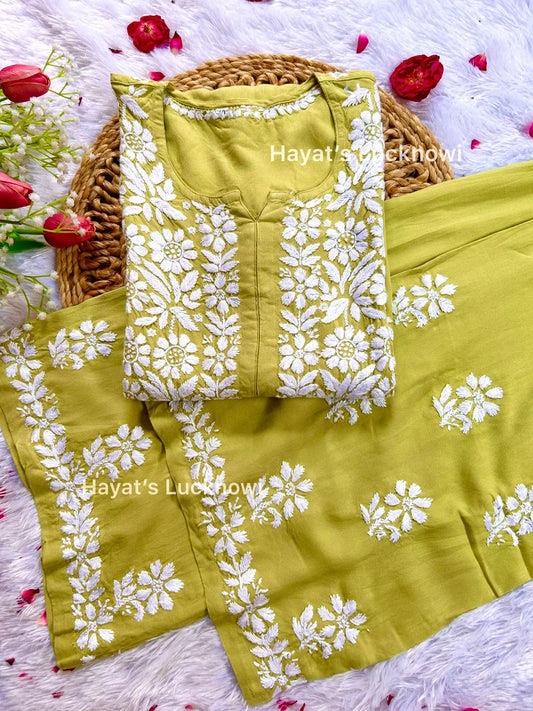Green chikankari rayon kurta set with intricate white floral embroidery, The set is from Hayat's Lucknowi