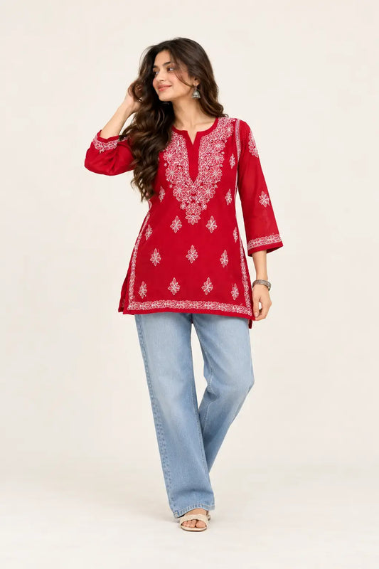 A woman modeling a red georgette kurta with white chikankari lucknowi embroidery